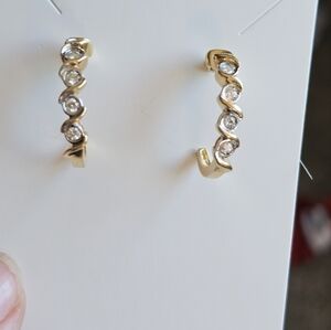 Solid 14k diamond earrings. Stamped 14k and genuine diamonds. Yellow gold with w